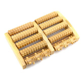 Wooden dual foot roller - A wooden foot massager with dual rollers, depicted with an inset image of a person using it on their foot. The device is designed to roll out the feet and promote blood circulation.