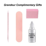 Set of Grandeur complimentary gifts including a pink cuticle pusher, pink nail file, and a bottle of premium cuticle oil on a white background.